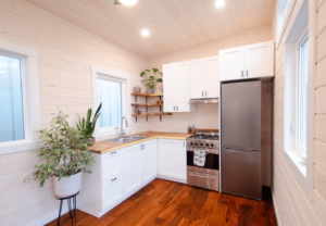 Extra-wide tiny house skips loft bedroom for comfortable small living