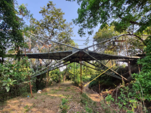 Habitable bridge spans 100 feet over two streams in rural India