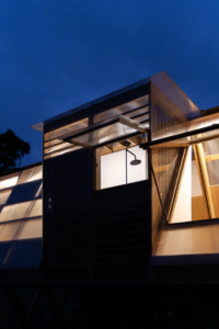Tiny triangular cabin perches off a slope in Ecuador's cloud forest