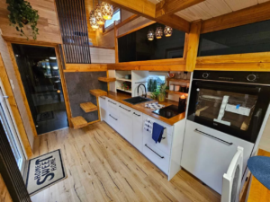 Tiny house goes extra-wide to deliver spacious small living